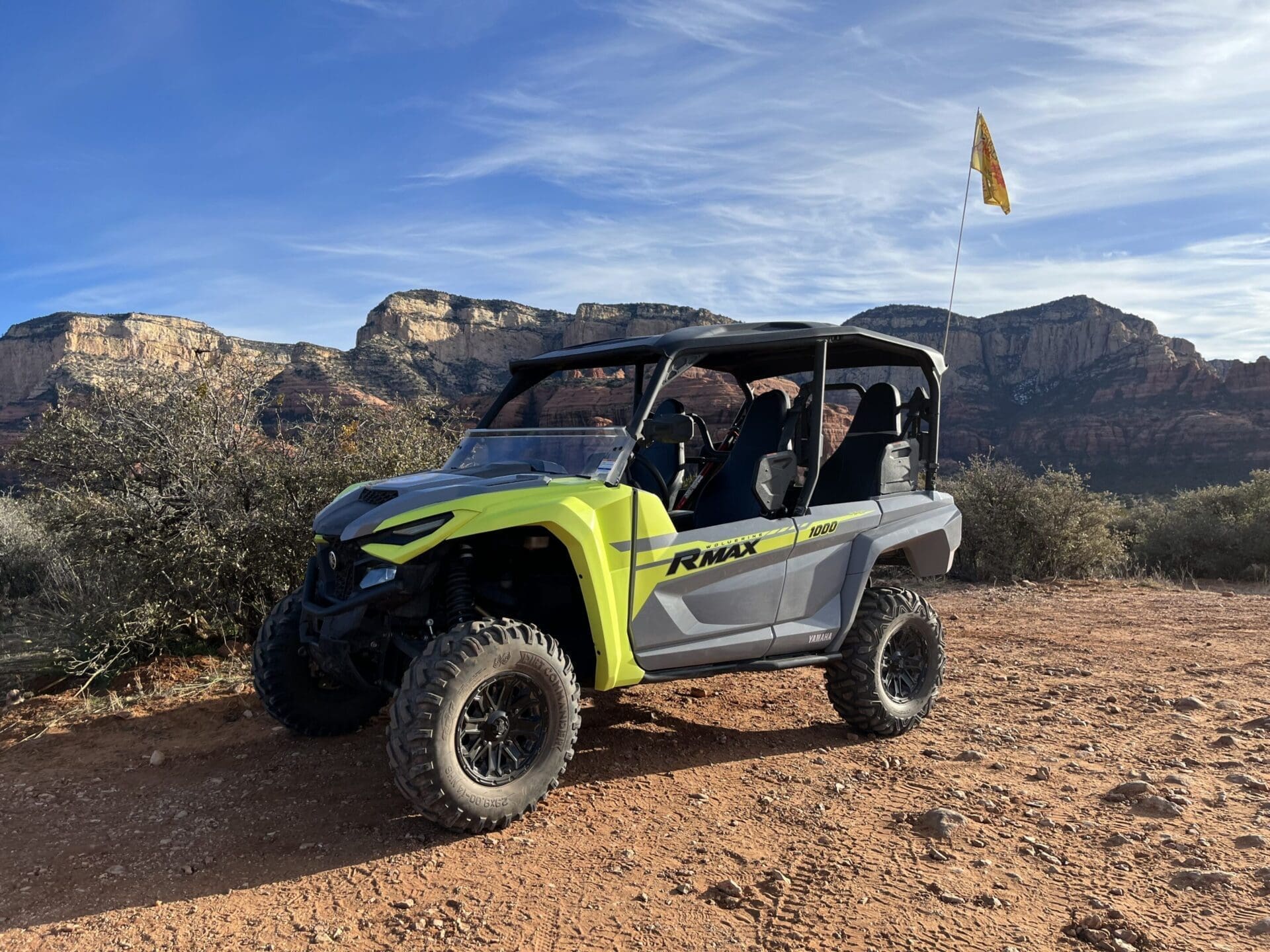 4-seater ATV rental on a sunny red rock 4x4 trail